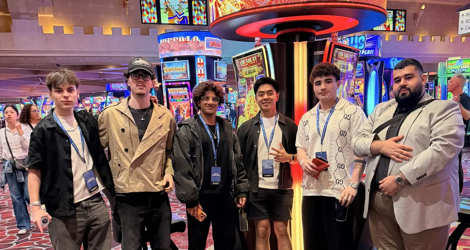 A group of Roblox creators and studio colleagues together at a Las Vegas event